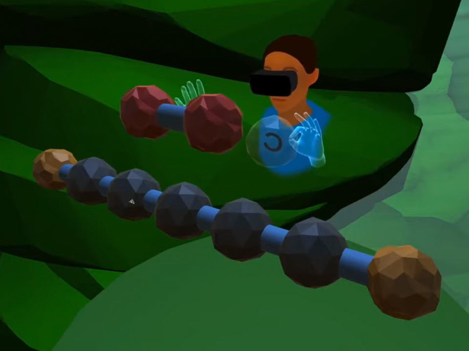 Student moving molecules in VR